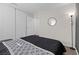 Serene bedroom with a black and gray patterned bedspread at 4027 Boratko St, Las Vegas, NV 89115