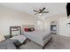 Main bedroom with ceiling fan and plush gray bedding at 4027 Boratko St, Las Vegas, NV 89115