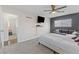 Spacious bedroom with a cozy sitting area and large TV at 4027 Boratko St, Las Vegas, NV 89115