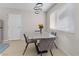 Small dining area with gray chairs and a concrete table at 4027 Boratko St, Las Vegas, NV 89115