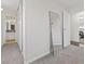 Bright hallway with carpet flooring and a large mirror at 4027 Boratko St, Las Vegas, NV 89115