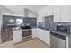 Modern kitchen with stainless steel appliances and gray countertops at 4027 Boratko St, Las Vegas, NV 89115