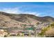 Neighborhood view with mountain backdrop; homes visible at 408 Matecumbe Way, Boulder City, NV 89005