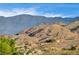 Aerial view showcasing a neighborhood's mountain backdrop at 408 Matecumbe Way, Boulder City, NV 89005