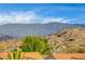 Stunning aerial view of homes nestled in mountains with blue skies at 408 Matecumbe Way, Boulder City, NV 89005