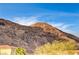 Mountainous landscape view with a home partially visible at 408 Matecumbe Way, Boulder City, NV 89005