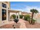 Landscaped backyard with a patio and grill at 408 Matecumbe Way, Boulder City, NV 89005