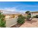 Landscaped backyard with a tiled patio and mountain views at 408 Matecumbe Way, Boulder City, NV 89005