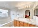 Bathroom features a large vanity, soaking tub, and shower at 408 Matecumbe Way, Boulder City, NV 89005