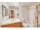 Clean bathroom with shower/tub combo and wood vanity at 408 Matecumbe Way, Boulder City, NV 89005