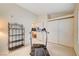 Bedroom with treadmill, shelving and double door closet at 408 Matecumbe Way, Boulder City, NV 89005