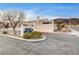 Community entrance with Key Largo sign and mountain view at 408 Matecumbe Way, Boulder City, NV 89005