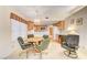 Cozy dining area with wood table and chairs, kitchen views, and access to living room at 408 Matecumbe Way, Boulder City, NV 89005