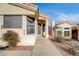 Front entry of the house with a walkway and desert landscaping at 408 Matecumbe Way, Boulder City, NV 89005