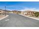 Residential street view, showcasing a hillside location with houses and desert landscaping at 408 Matecumbe Way, Boulder City, NV 89005