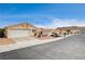 Street view of a neighborhood with several single-story houses, showcasing a quiet community setting at 408 Matecumbe Way, Boulder City, NV 89005