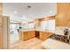 Well-equipped kitchen with light wood cabinets and tile flooring at 408 Matecumbe Way, Boulder City, NV 89005