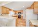 Bright kitchen with light wood cabinets and tile flooring at 408 Matecumbe Way, Boulder City, NV 89005