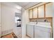 Laundry room with washer, dryer and cabinets at 408 Matecumbe Way, Boulder City, NV 89005