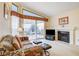 Living room with fireplace, patio access and a view, and seating area at 408 Matecumbe Way, Boulder City, NV 89005