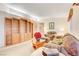 Living room showcasing a wooden cabinet and comfortable seating area at 408 Matecumbe Way, Boulder City, NV 89005