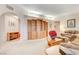 Spacious living room featuring a built-in wooden cabinet and comfortable seating at 408 Matecumbe Way, Boulder City, NV 89005