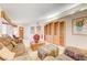 Open living room with built-in shelving and comfortable seating at 408 Matecumbe Way, Boulder City, NV 89005