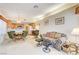 Living room with a couch, chairs, and views of the patio and kitchen at 408 Matecumbe Way, Boulder City, NV 89005