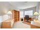 Home office with wood desk and built-in shelving at 408 Matecumbe Way, Boulder City, NV 89005