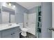 Clean bathroom with a shower/tub combo and gray vanity at 4730 E Craig Rd # 2158, Las Vegas, NV 89115