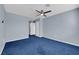 Bright bedroom with blue carpet and access to hallway at 4730 E Craig Rd # 2158, Las Vegas, NV 89115