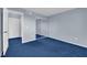 Spacious bedroom with mirrored closet doors and blue carpet at 4730 E Craig Rd # 2158, Las Vegas, NV 89115