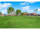 Green grassy area with playground equipment at 4730 E Craig Rd # 2158, Las Vegas, NV 89115