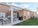 Relaxing backyard patio with pergola, seating, and grill at 5370 Cholla Cactus Ave, Las Vegas, NV 89141