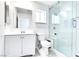 Updated bathroom with white vanity, toilet and large glass shower at 5476 Green Horn St, Las Vegas, NV 89118