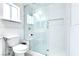 Modern bathroom with a glass shower, built-in bench, and white subway tiles at 5476 Green Horn St, Las Vegas, NV 89118