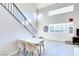 Bright dining area with white table and chairs at 5476 Green Horn St, Las Vegas, NV 89118