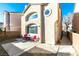 Tan two-story home with a private patio and walkway at 5476 Green Horn St, Las Vegas, NV 89118