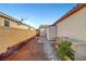 Landscaped backyard with storage shed and pathway at 5805 Vibrant Violet Ct, Las Vegas, NV 89130