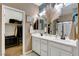 Double vanity bathroom with a walk-in shower at 5805 Vibrant Violet Ct, Las Vegas, NV 89130