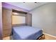 Bedroom with a murphy bed and built-in storage at 5805 Vibrant Violet Ct, Las Vegas, NV 89130