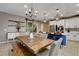 Farmhouse style dining area with rustic wooden table and bench at 5805 Vibrant Violet Ct, Las Vegas, NV 89130