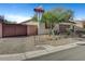 Landscaped front yard with a gated entryway at 5805 Vibrant Violet Ct, Las Vegas, NV 89130