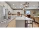 Modern kitchen with white cabinets and a large island at 5805 Vibrant Violet Ct, Las Vegas, NV 89130