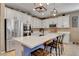 Modern kitchen with white cabinets and a large island at 5805 Vibrant Violet Ct, Las Vegas, NV 89130