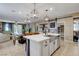 Spacious kitchen with island, stainless steel appliances, and farmhouse sink at 5805 Vibrant Violet Ct, Las Vegas, NV 89130