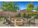 Patio with fire pit and two adirondack chairs at 5805 Vibrant Violet Ct, Las Vegas, NV 89130