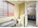 Small bathroom with toilet and bench at 6074 Lazarro Ct, Las Vegas, NV 89139