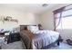 Bedroom with double bed, nightstand, and window at 6074 Lazarro Ct, Las Vegas, NV 89139