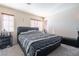 Spacious bedroom with king-size bed and neutral decor at 6074 Lazarro Ct, Las Vegas, NV 89139